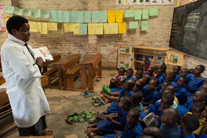 Children listening as the teacher reads a story